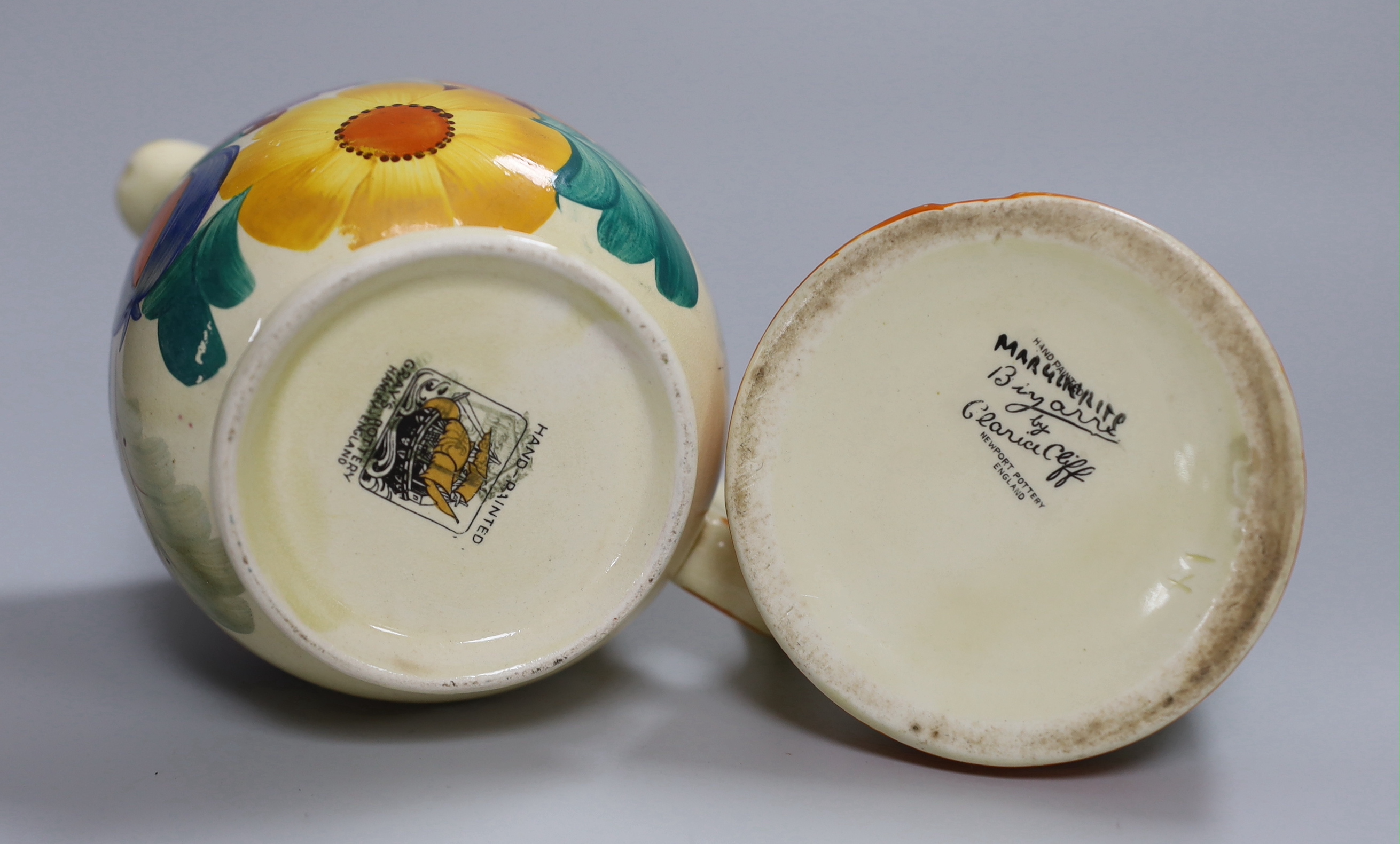 An early Clarice Cliff Fantasque plate, a Clarice Cliff honey pot and a Gray's jug, a.f.